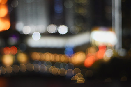Abstract circular bokeh background of city at night, defocused