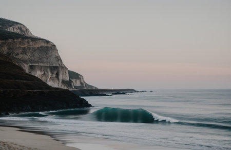Sunset on the beach of the Atlantic Ocean in Nazare, Portugalの素材