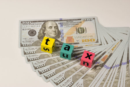 Tax forms and currency, a visual representation of financial obligations.