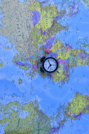 Black stopwatch on world map.の写真素材