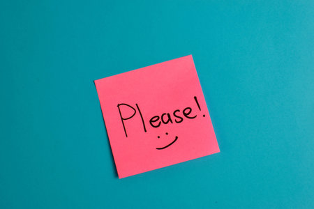 Handwritten note on red background reads with smiley face symbolic expression of affection and emotional warmth.の写真素材