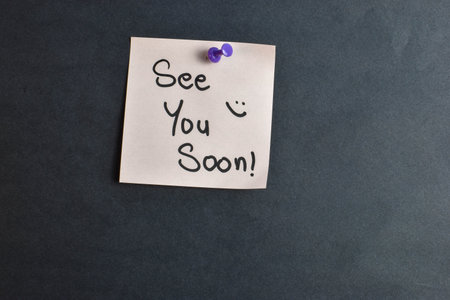 Handwritten note reads with smiley face symbolic expression of affection and emotional warmth.の写真素材