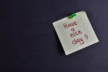 Pinned note reads words in handwriting.