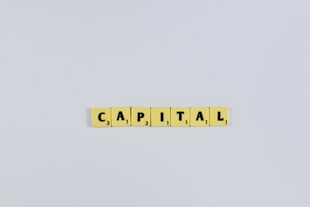 Scrabble tiles spell Capital Structure a finance term for a firm mix of debt and equity used to fund operations.の写真素材