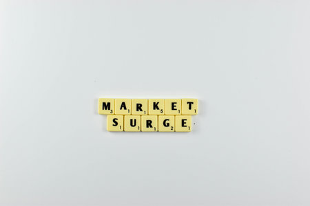 scrabble word merge as Market Surge on the white isolated backgroundの写真素材