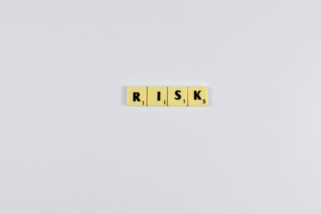 Scrabble tiles spell Risk a finance term for a firm mix of debt and equity used to fund operations.の写真素材
