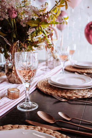 pink wedding party table decoration with candles and menuの写真素材