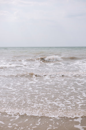 Sea waves on the beach. Soft focus and shallow DOF.の写真素材