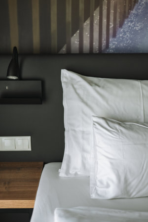 White pillow on bed decoration in hotel bedroom interior - Vintage Light Filterの写真素材