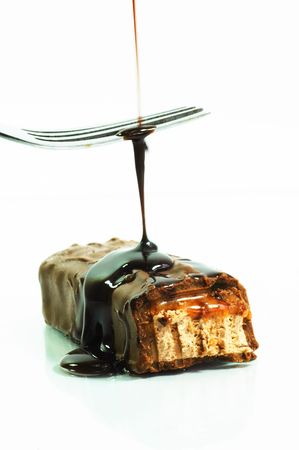 Chocolate flavored syrup over a soft nougatの写真素材