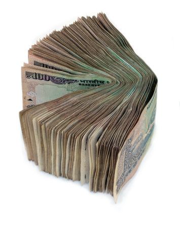 A stack of old indian hundred rupee notes