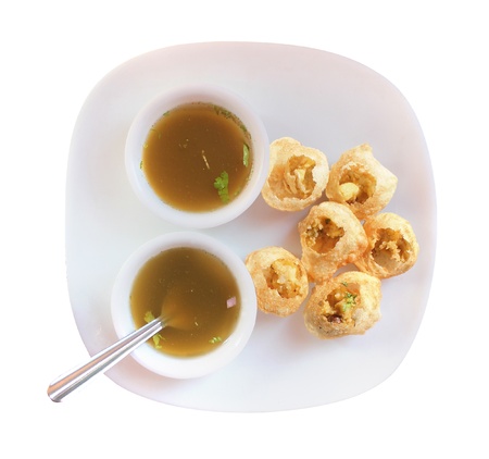Panipuri snack also called gol gappa or phuchka - a famous indian delicacy isolated on whiteの写真素材