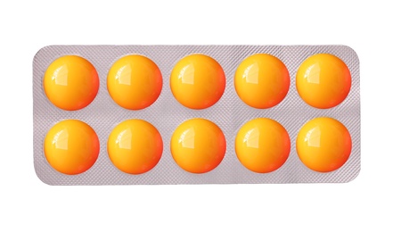Colorful medicinal tablet strip isolated on white の写真素材