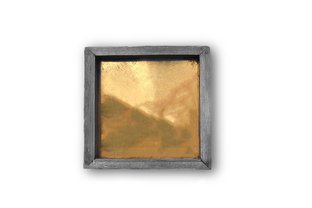 Empty or blank wooden plaque with  golden colored sheet on a white backgroundの写真素材