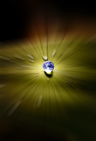 Planet earth waterdrop on leaf glowing in sunlight. Earth picture credit to: http://visibleearth.nasa.gov の写真素材