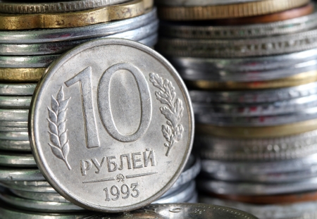 Russian rouble or ruble currency coin with stack of coins piled in the backgroundの写真素材