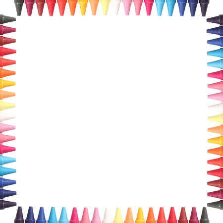 Multi color pastel crayon  pencils border isolated on white with clipping path and copy space for text in the centerの写真素材