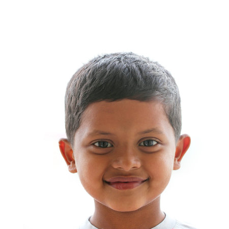 Cute, smart, happy and handsome indian boy(kid) smiling and looking satisfied and content.

