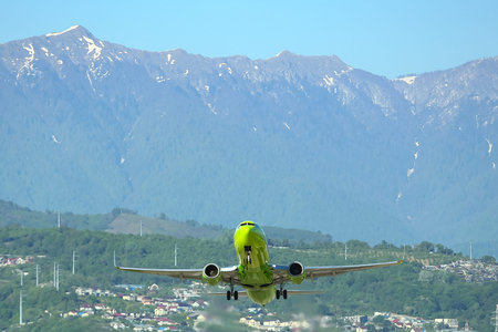 airplane taking off in the background