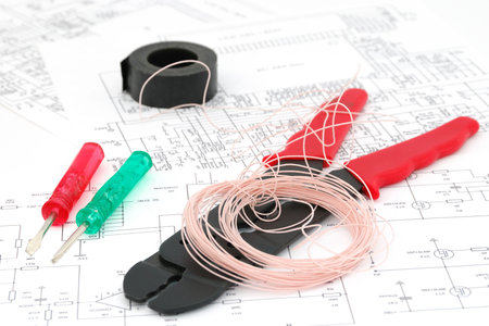 Screwdrivers, wires, a tool for cabling, electric schemes