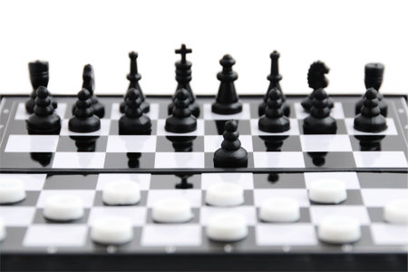 Black chess against white checkers on the board