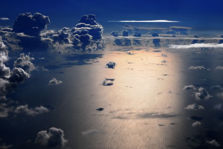 Aerial view of sea and cumulus clouds at nightの写真素材
