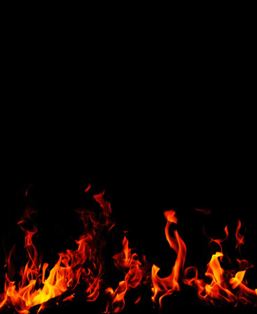 Background with vivid fire flames isolated on blackの写真素材