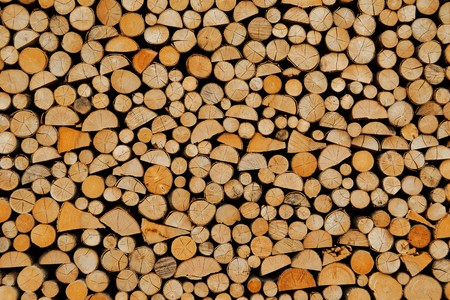 Wood stock background  stacked firewood patternの写真素材