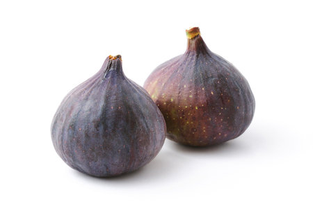 Couple of ripe organic figs isolated on white