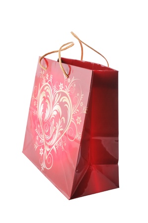 Gift paper bag with heart isolated on whiteの写真素材