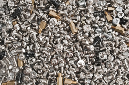 Heap of computer screws, bolts and nuts. Technical background.の写真素材