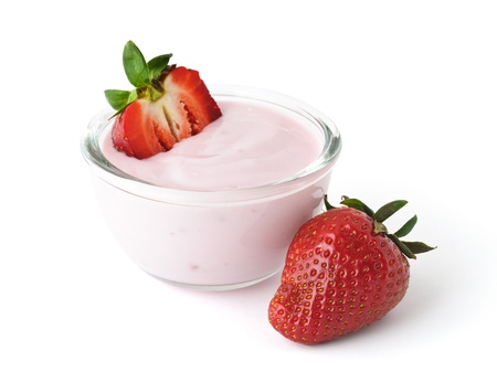 Fresh juicy strawberry with yogurt in a glass bowl isolated on white backgroundの写真素材