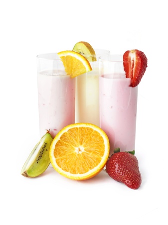 Three glasses of yogurts with strawberry, kiwi and orangeの写真素材