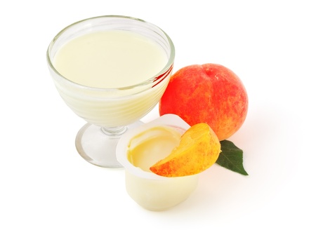 Healthy products. Yogurt and smoothie with peach fruit.の写真素材