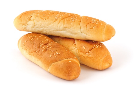 Three buns with sesame seeds on white background with soft shadowの写真素材