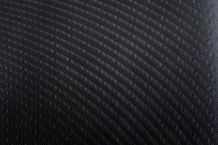 Black plastic textured surface with periodic rectangular patternsの写真素材