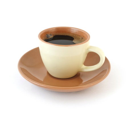 Espresso in the cup with saucer on white background の写真素材