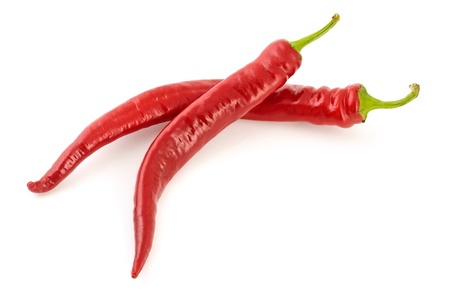 Couple of fresh hot chili peppers on white background with soft shadowの写真素材
