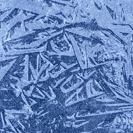Ice texture of frozen lake in winterの写真素材