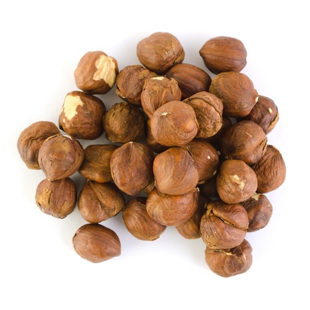 Heap of peeled hazelnuts isolated in white  Top view の写真素材