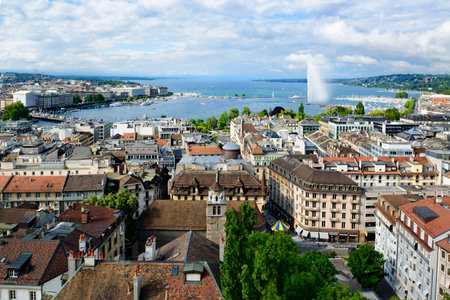 Geneva cityscape with roofs, houses, lake and fountainの写真素材
