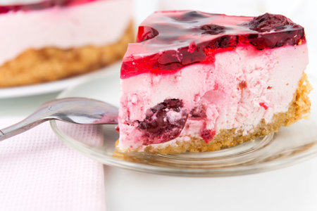Delicious cherry cake portion with a spoon