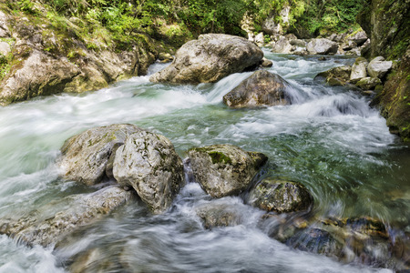 Beautiful mountain river stream with rocks and stonesの写真素材