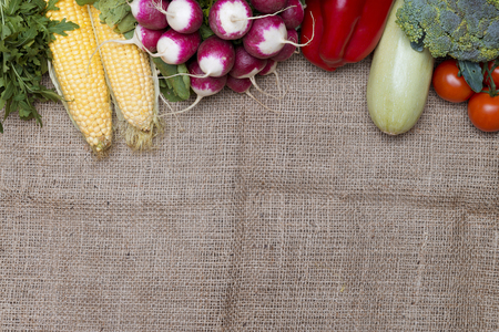 Line of vegetables on a sackcloth backgroundの写真素材