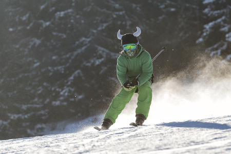 Bukovel, Ukraine, December 2016  Skier in a funny hat moving downhill in famous Ukrainian winter resortのeditorial素材