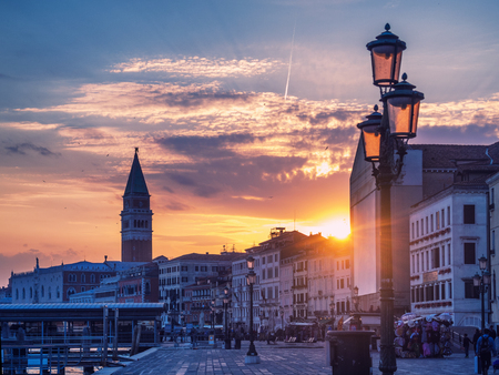 Magic sunset in Venice with view to San Marco Campanile and old buildingsの写真素材