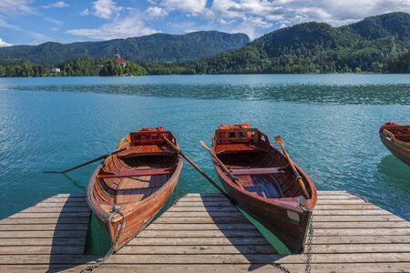 Pier with rent boats on a famous Bled lake in Slovenia. Popular summer tourist destinationの写真素材