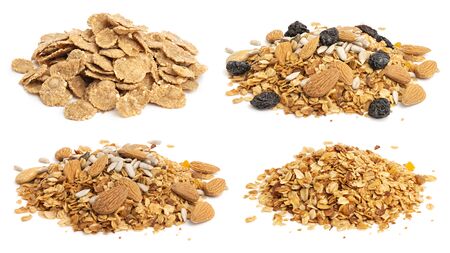 Collection of heaps of muesli, flakes and granola with raisins, seeds and nuts. Healthy eating conceptの写真素材