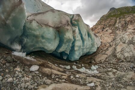 Giant ice stones of Aletsch glacier. Blue ice of Europe largest glacierの写真素材
