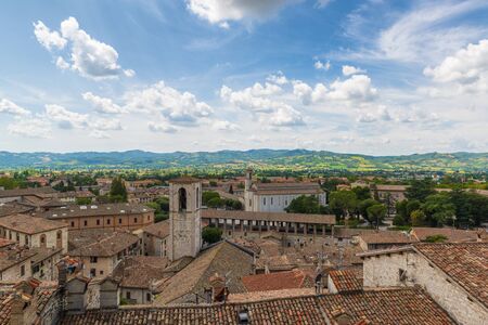 Red roof tiles of old Gubbio town in Italy. Old city center in Gubbio, Perugiaの写真素材